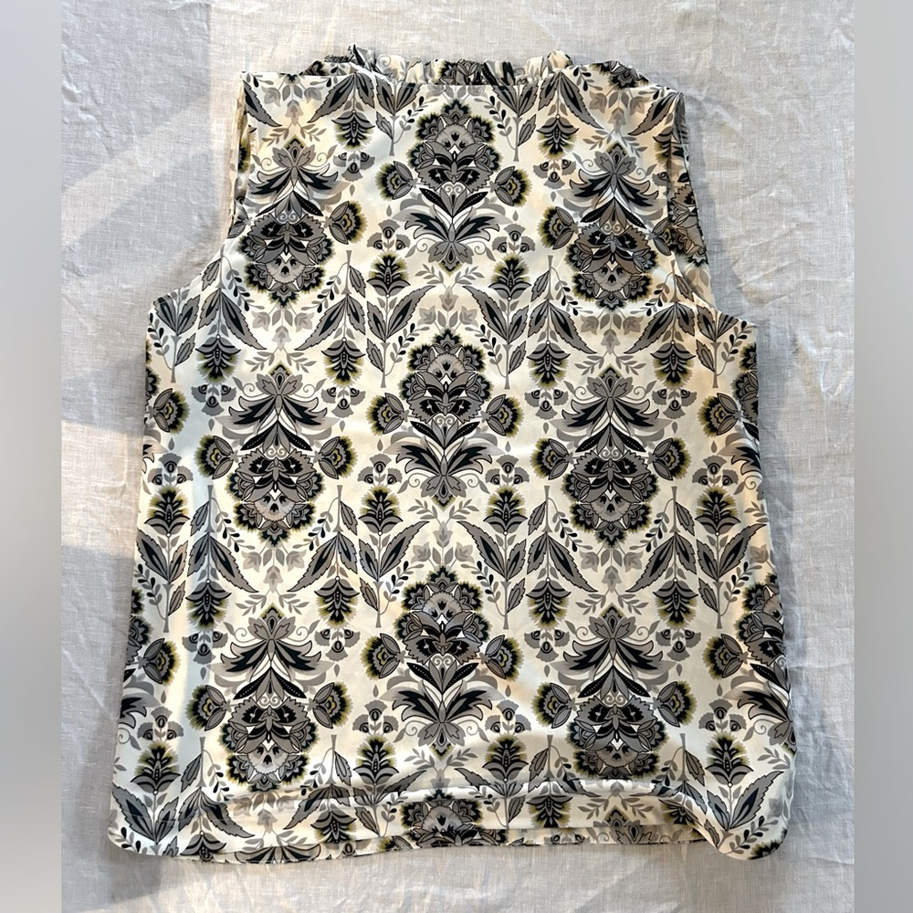 Ann Taylor Factory XL women’s sleeveless V-neck blouse with ruffled neckline.